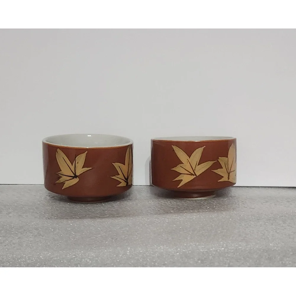 vintage ceramic tea bowls featuring an autumn maple leaf pattern